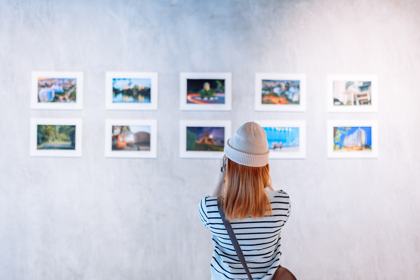 Woman looking photo in art gallery